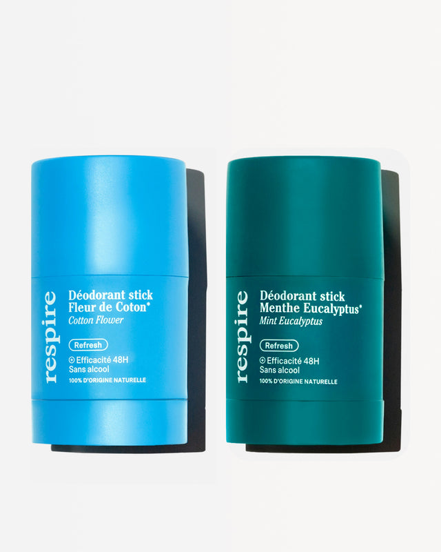 Two deodorant sticks: Cotton Flower in blue, Mint Eucalyptus in green.